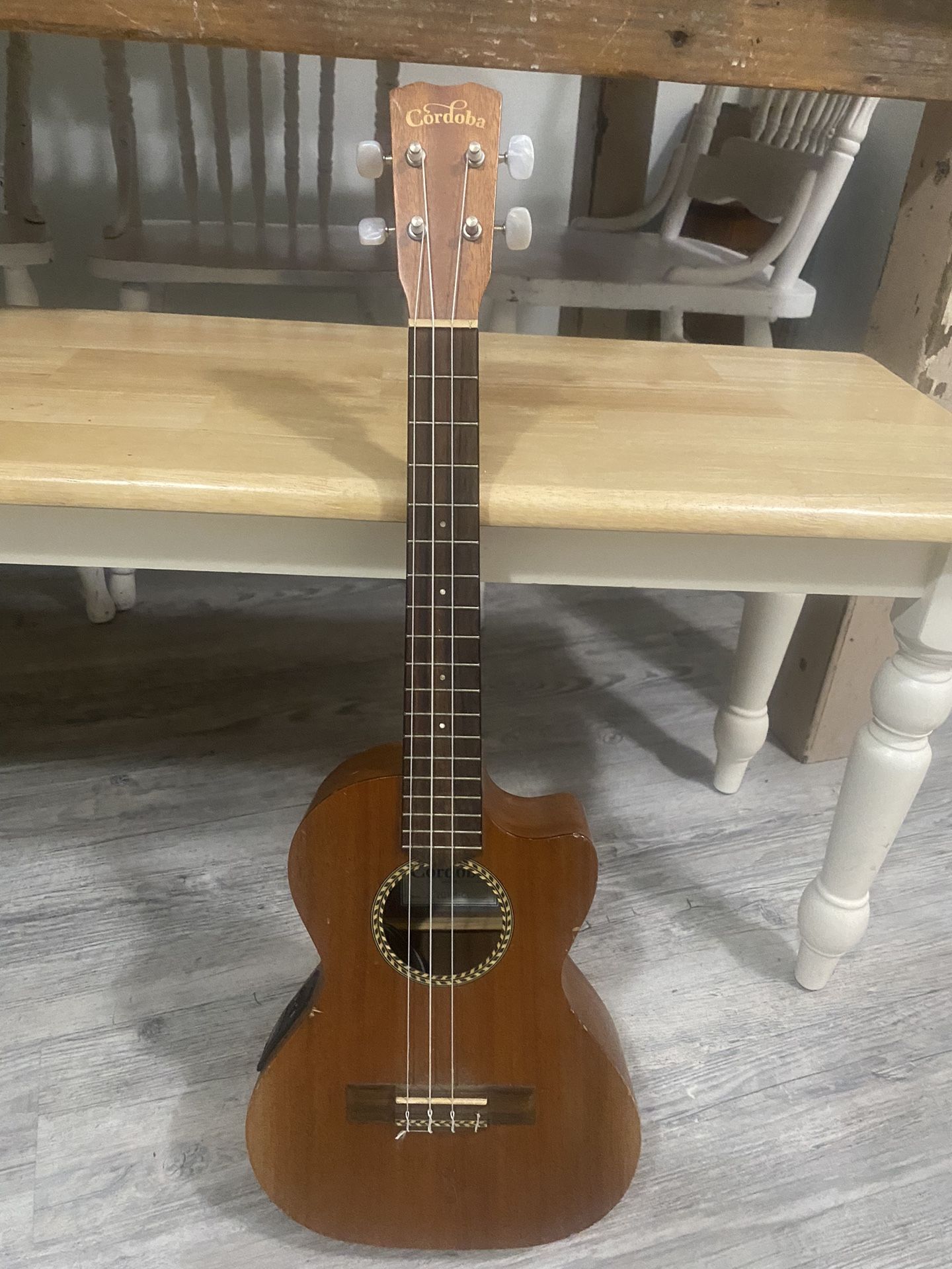 Cordoba 20TM-CE Mahogany Tenor Cutaway Ukulele Tenor Cutaway Electric missing, one string, pick up only located in Orting.   Guitar electric 