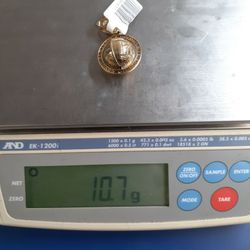 WORLD  IS YOUR PENDANT 14K   10.7GRAMS