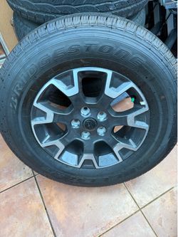 (4) Jeep Take Off Wheels and Tires. Bridgestone Dueler H/T - Brand new.