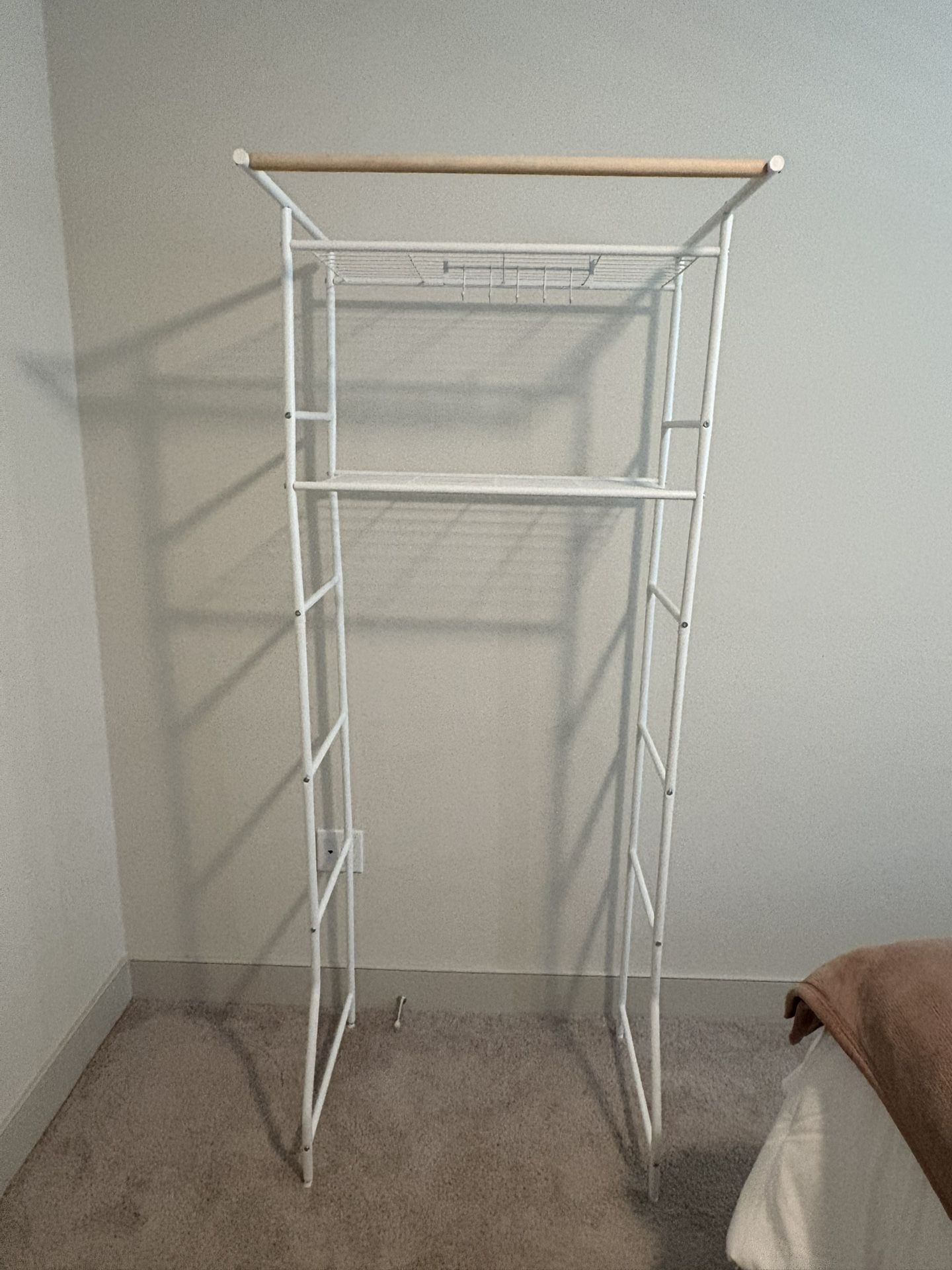 White over washer storage shelves