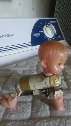 Antique wind up metal and plastic doll, make offer