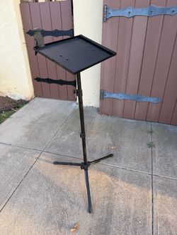 Adjustable stand with tripod base