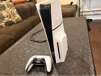 PlayStation 5 with disc drive and controller
