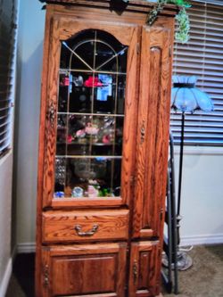 Curio set oak very heavy. They go together or apart, as I have them. They light up, they have a key to lock all the doors and drawers work. The glass 