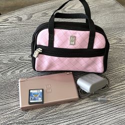 Nintendo DS with a game, & case, complete with stylus & charger. $55