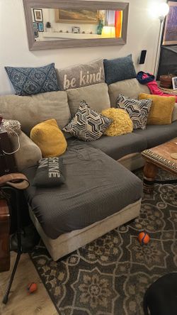 Living spaces couch (slip covers included) tan with chaise lounge