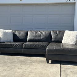 Free Delivery/ Leather Sectional Sofa by Ashley Furniture 