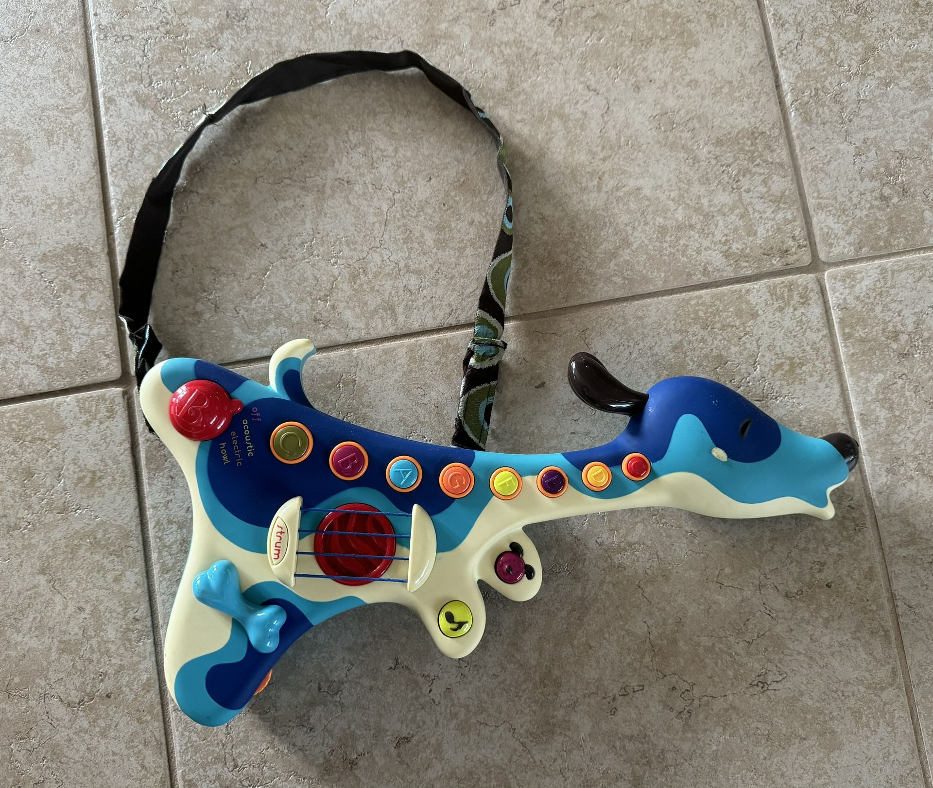 B. toys Woofer Interactive Dog Guitar Musical Toys 3 Music Modes