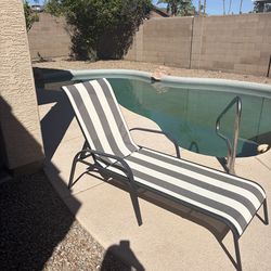 Black and white striped pool chaise lounge chair