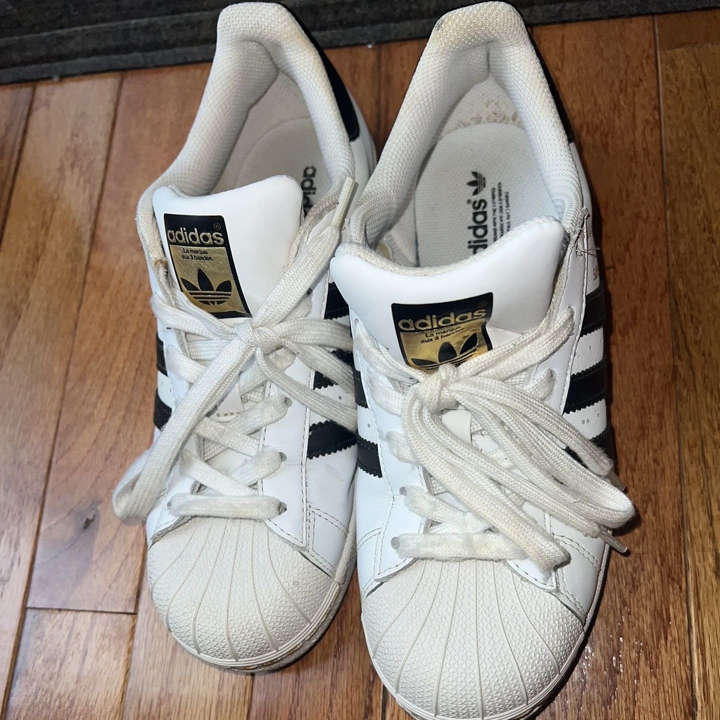 Classic Adidas Superstar Sneakers in Black & White with Gold Accents