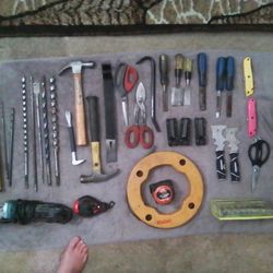 A Whole Load Of Hand Tools Two Hammers Two Pry Bars Two Large Cutters To Paint Knives Six Chisels There Is A Wire Puller For Electricians That Were Gr