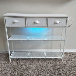White Metal and Wooden Console/Entry/Sofa Table with 3 Fabric Drawers, Shelves, Charging Station and LED Lights