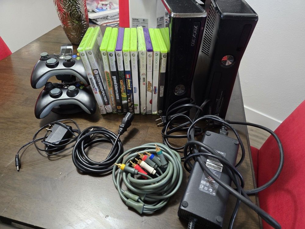 Two Xbox 360 consoles, remotes and games