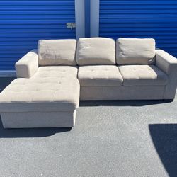 Beige L Shaped Couch With Storage And Fold Out Bed 