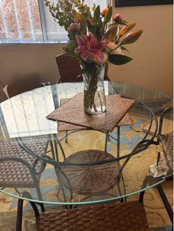 Sleek modern Round glass Rattan Dining set 4 chairs. Crate & Barrel