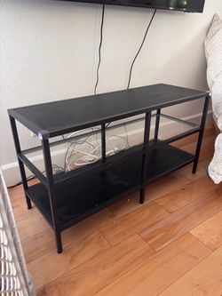 Tv console with glass shelf