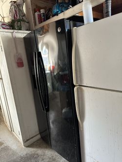 GE black double door refrigerator in good condition 