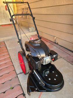 ~GAS STRING TRIMMER/MOWER DESIGNED FOR THICK WEEDS BRUSH AND TALL GRASS IN GREAT WORKING CONDITION TURNS ON FIRST PULL~