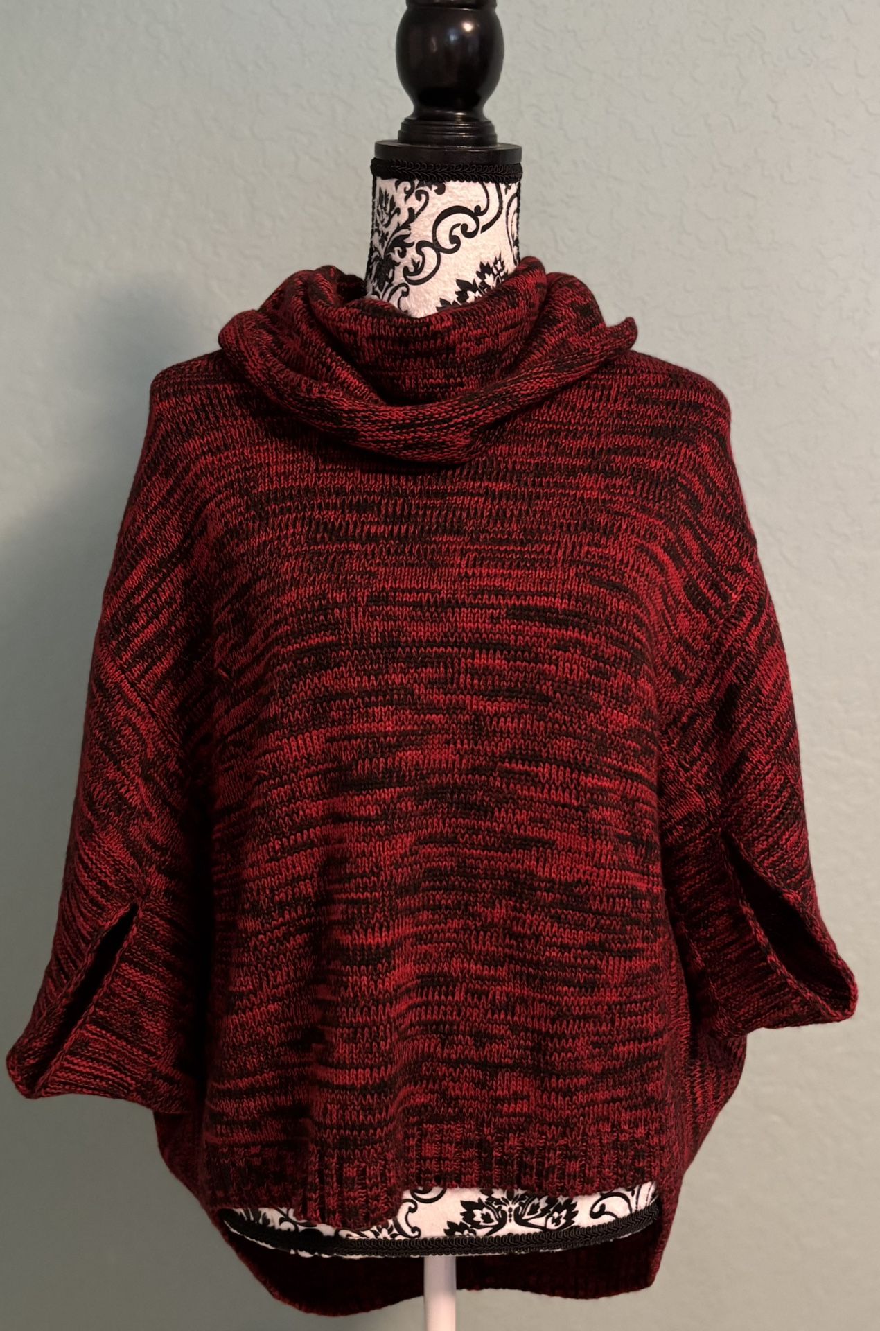 Cozy red knit poncho with cowl neck.