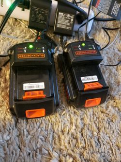 Two Black And Decker Batteries And Charger