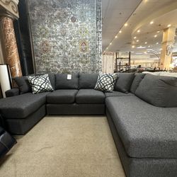 Grey Section With 4 Throw Pillows 