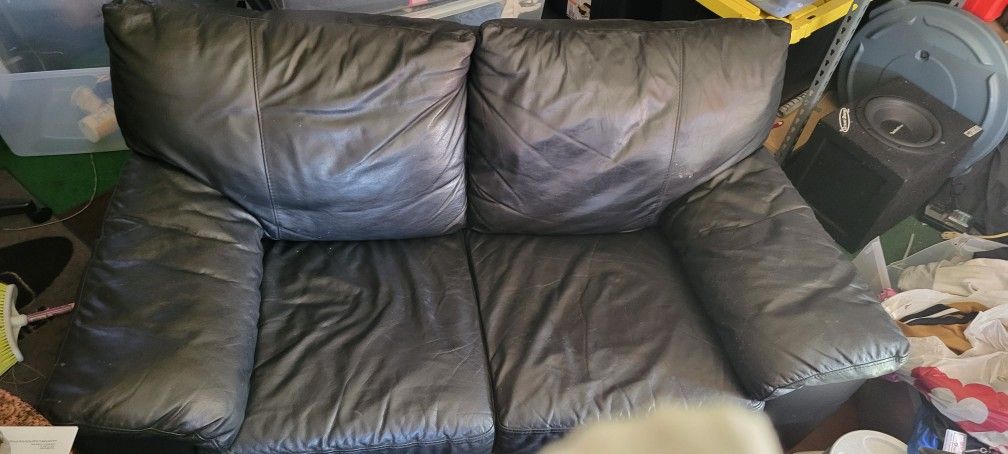 Black Leather Love Seat  34" X 56"X 30"