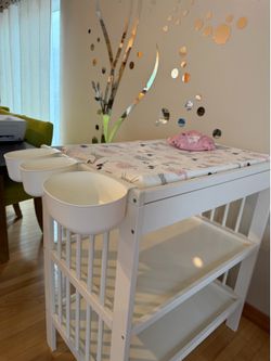 Changing table with mattress pad