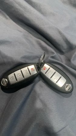 Two Nissan keys in good condition
