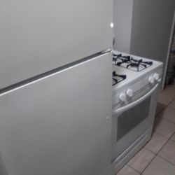 GE, Refrigerator & A Frigidaire Stove 
