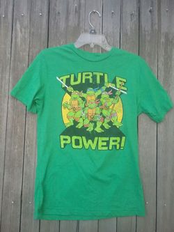 Teenage mutant ninja turtle t shirt top. It says s/ch (34-36). It looks like a men's small or gal' s medium to me. Make offer.
