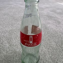 2014 souvenir empty bottle from the world of Coca-Cola 8 fl oz