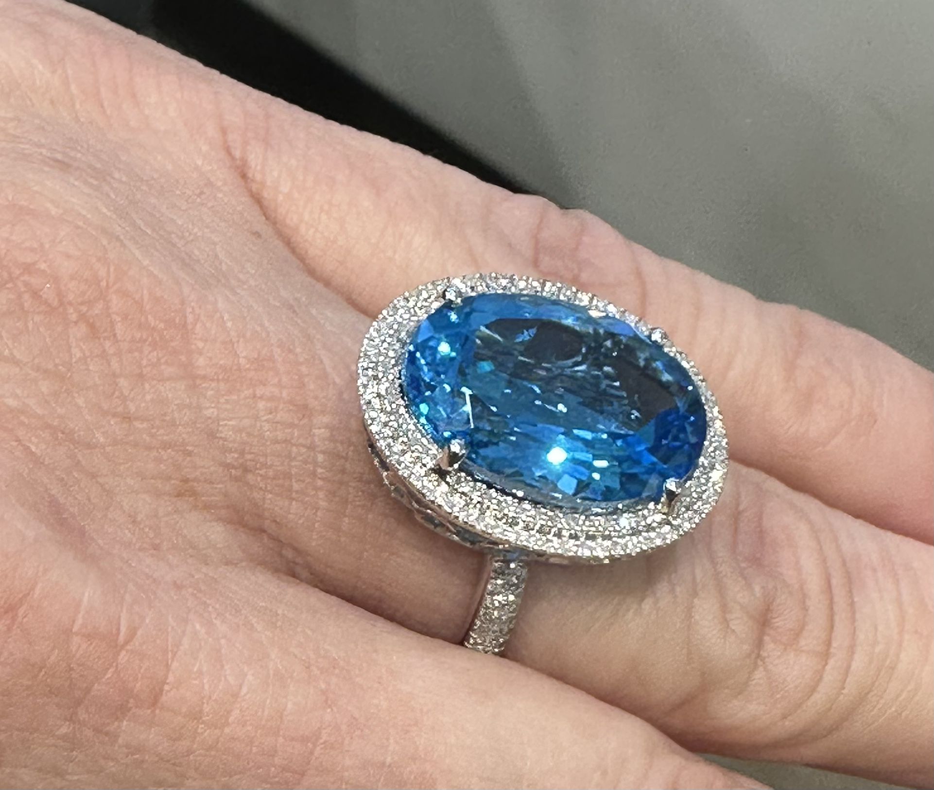 Blue Topaz With Diamond Halo Ring