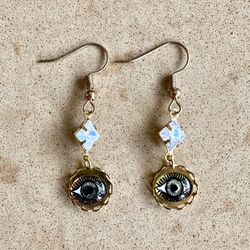 👀 Absolutely gorgeous handmade earrings in gold tone settings with rhinestone charms and metallic eyeballs