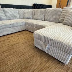 Beige Fabric Sectional with Pull-Out Bed. Brand New. 