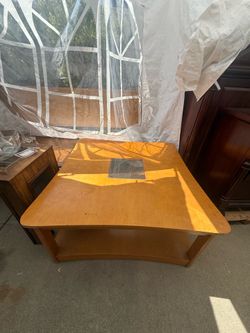 Blond wood coffee table with glass insert