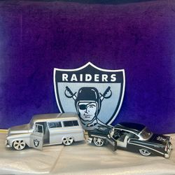 Two Customized Raiders Die-cast Models — Silver 57’ Chevy Suburban & Black 56’ Chevrolet Bel Air — (1:24 scale/Jada Toys) & Lg. 9" Raiders Iron-on Pat