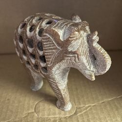 Beautiful, small, smaller hand carved soapstone elephant figurine with baby elephant inside