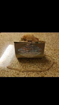 Gold clutch with front accent stones