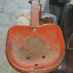 Large red tractor seat