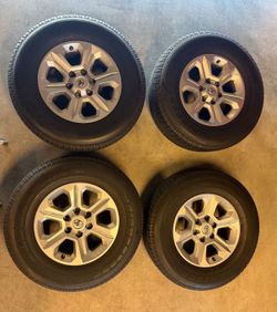 Four tires P265/70R17 Bridgestone dueller H/ T and four 2023 toyota 4Runner Wheels for sale!