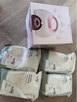 Brand New Spectra Breast Pump with 400 storage bags