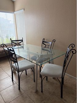 Glass table with 4 chairs