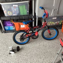 Huffy Spiderman themed 16” BMX bicycle in excellent condition. With blue wheels, spiderweb handlebar,foot breaking system.  I do have a set of trainin