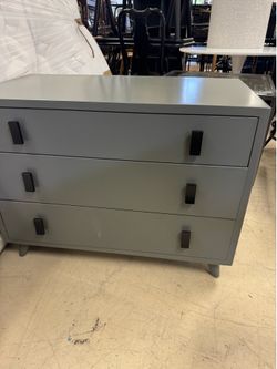 Safavieh Blaize 3-Drawer Chest in dark gray features minimalist, contrasting black drawer pulls -