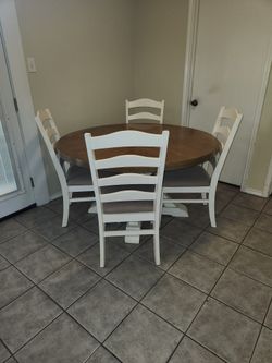 Round white dining room table for chairs