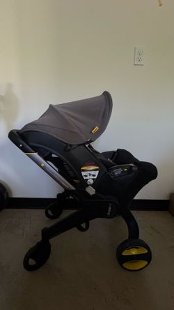 Doona Convertible Infant Car Seat/Compact Stroller System with Base+Travel Bag Included