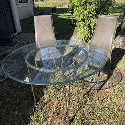 Bistro set. Glass table.  Leather chairs!