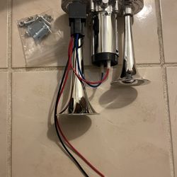 Powerful and loud double trumpet air horn, comes with air compressor attached and relay. Brand New.  Good for cars, boats, motorcycles, rv, atv, campe