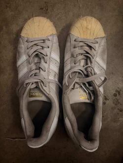 gray Adidas Superstar sneakers