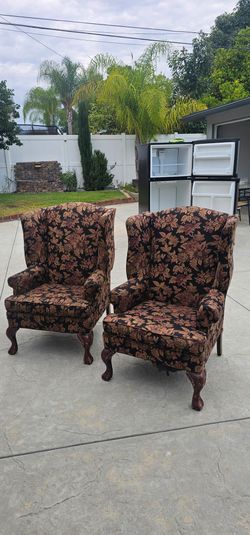 Pair of Floral Wingback Chairs with Ball and Claw Feet